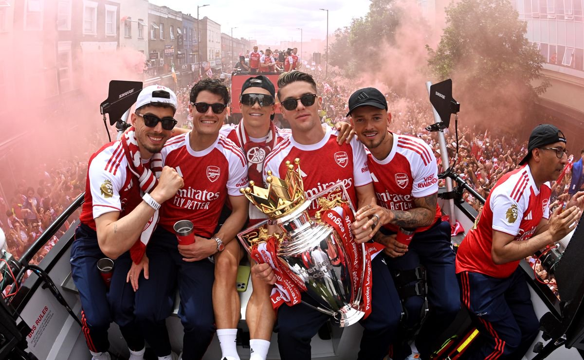 Arsenal's players celebrate their Premier League title triumph