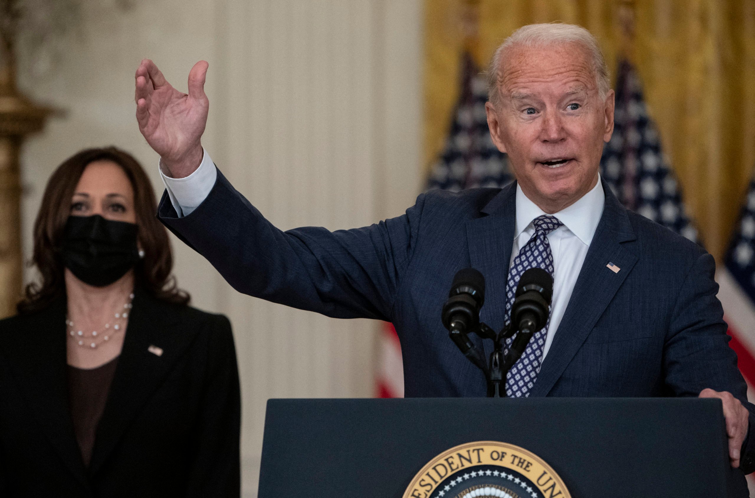 US President Joe Biden, with Vice President Kamala Harris, responds to questions about the ongoing US military evacuations of US citizens and vulnerable Afghans, in the East Room of the White House in Washington, DC, on August 20, 2021. Biden said Friday he has not seen America's allies question US credibility over the conduct of its withdrawal from Afghanistan as the Taliban took over the country. (Photo by ANDREW CABALLERO-REYNOLDS / AFP) (Photo by ANDREW CABALLERO-REYNOLDS/AFP via Getty Images)
