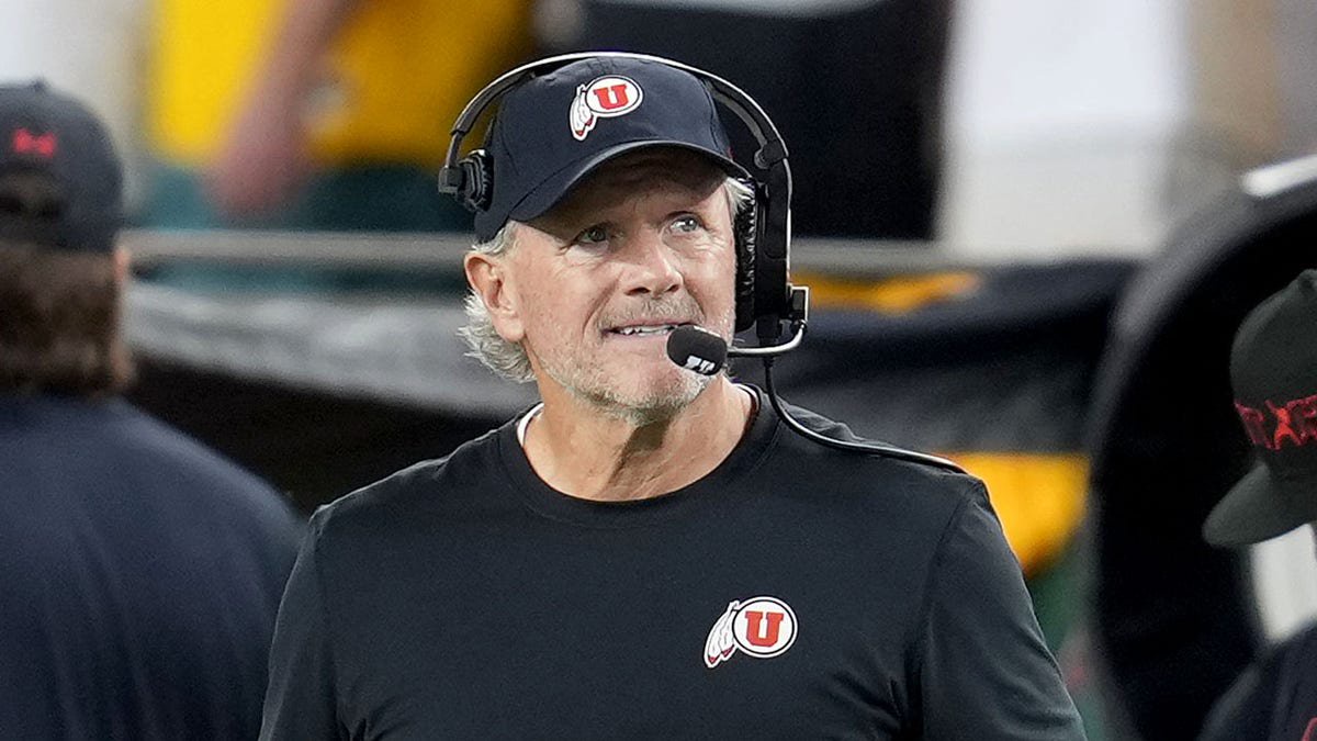 Kyle Whittingham looks on