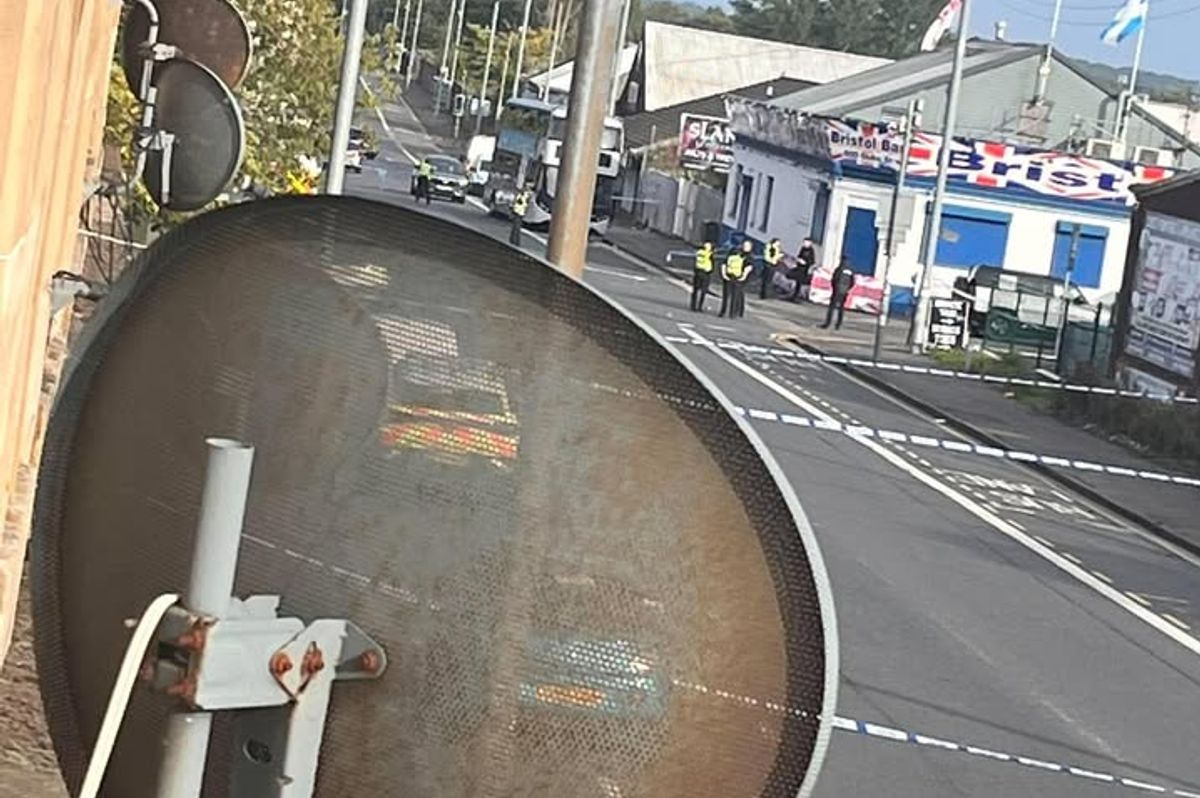 Police stand guard outside the Bristol Bar