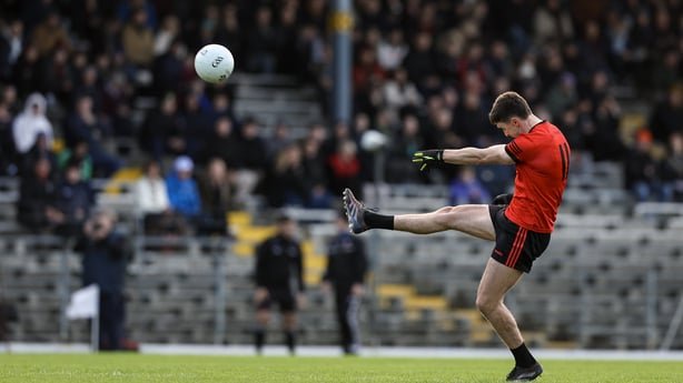 Seanie O'Shea of Kenmare Shamrocks kicks a point during the Kerry County Senior Football Championship final match between Dr Crokes and Kenmare Shamrocks at Fitzgerald Stadium in Killarney, Kerry.