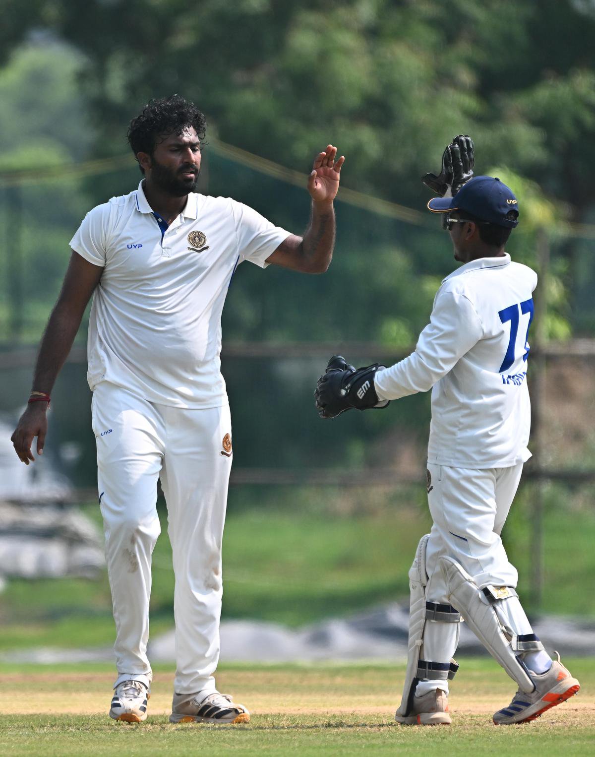 Andhra's Saiteja celebrates the wicket of Hyderabad's Rahul Radesh.