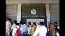 Mumbai, India - March 31, 2015 : People stand in queue to file their IT returns on last day of financial year outside Income Tax office at BKC, Bandra in Mumbai, India, on Tuesday, March 31, 2015. (Photo by Pratham Gokhale/ Hindustan Times) (Hindustan Times)