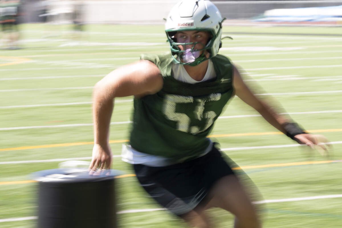 Peninsula’s TJ Strilcov (55) runs drills during football practice at Peninsula High School, on Thursday, Aug. 20, 2026, in Gig Harbor.