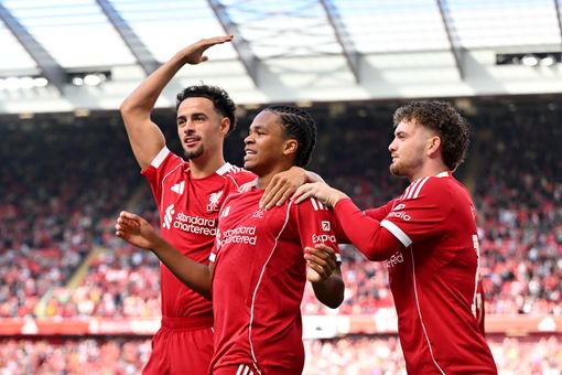 Rio Ngumoha celebrates with Harvey Elliott and Curtis Jones