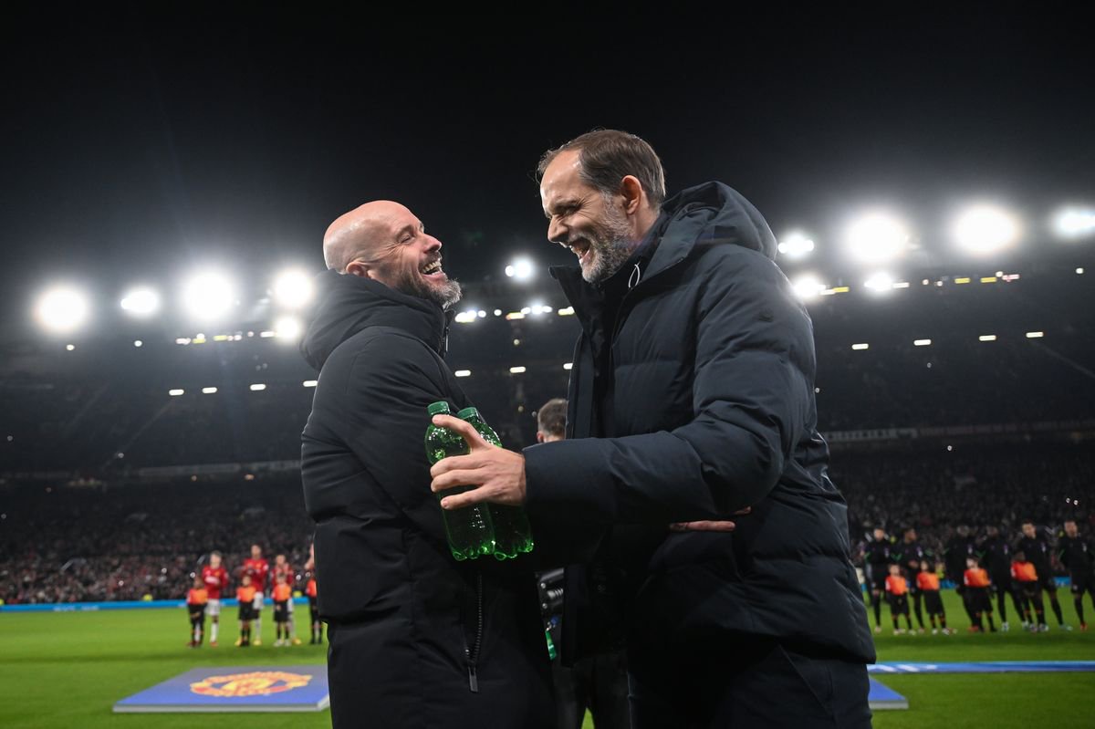 MANCHESTER, ENGLAND - DECEMBER 12: Manchester United manager Erik ten Hag laughs with Bayern Munich manager Thomas Tuchel before the UEFA Champions League match between Manchester United and FC Bayern München at Old Trafford on December 12, 2023 in Manchester, England. (Photo by Michael Regan - UEFA/UEFA via Getty Images)