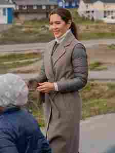 Image may contain Mary Crown Princess of Denmark Face Happy Head Person Smile Adult Clothing Coat and Formal Wear