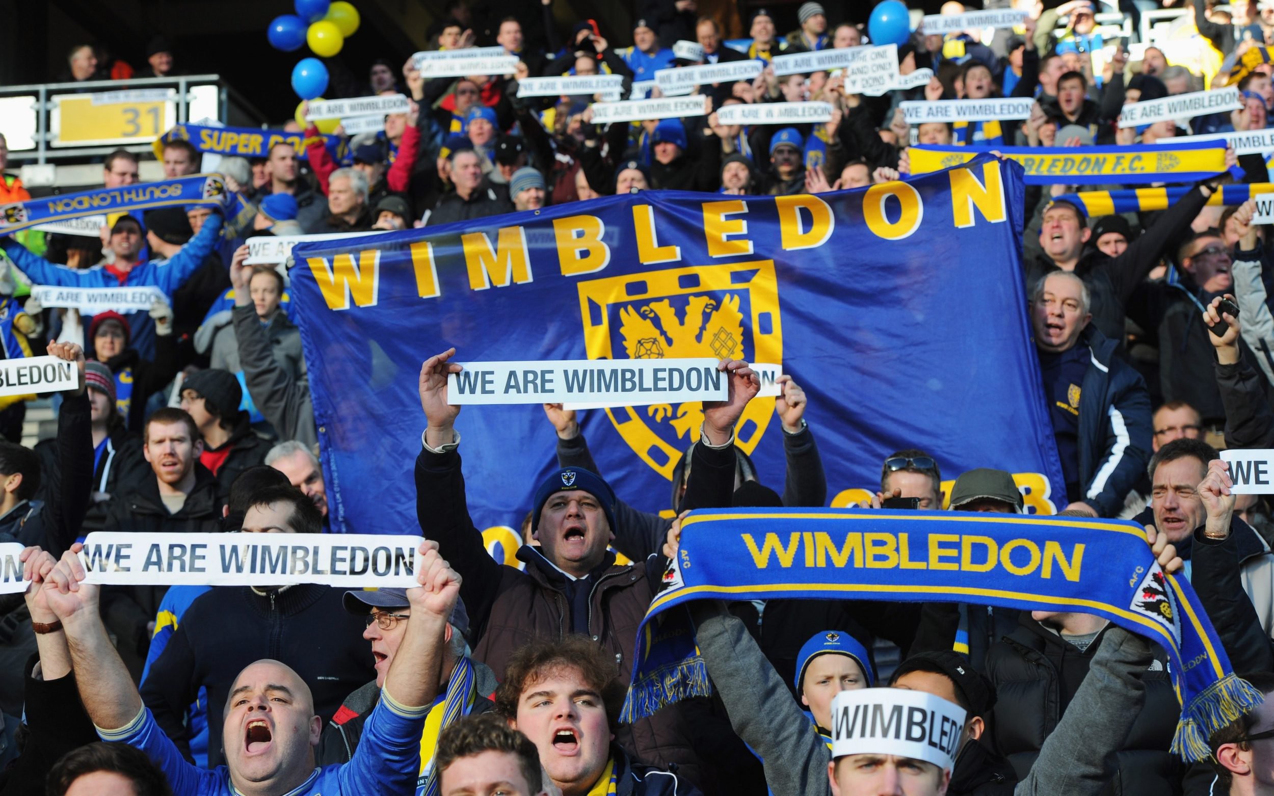 AFC Wimbledon fans support their team prior to the FA Cup with Budweiser Second Round match between MK Dons