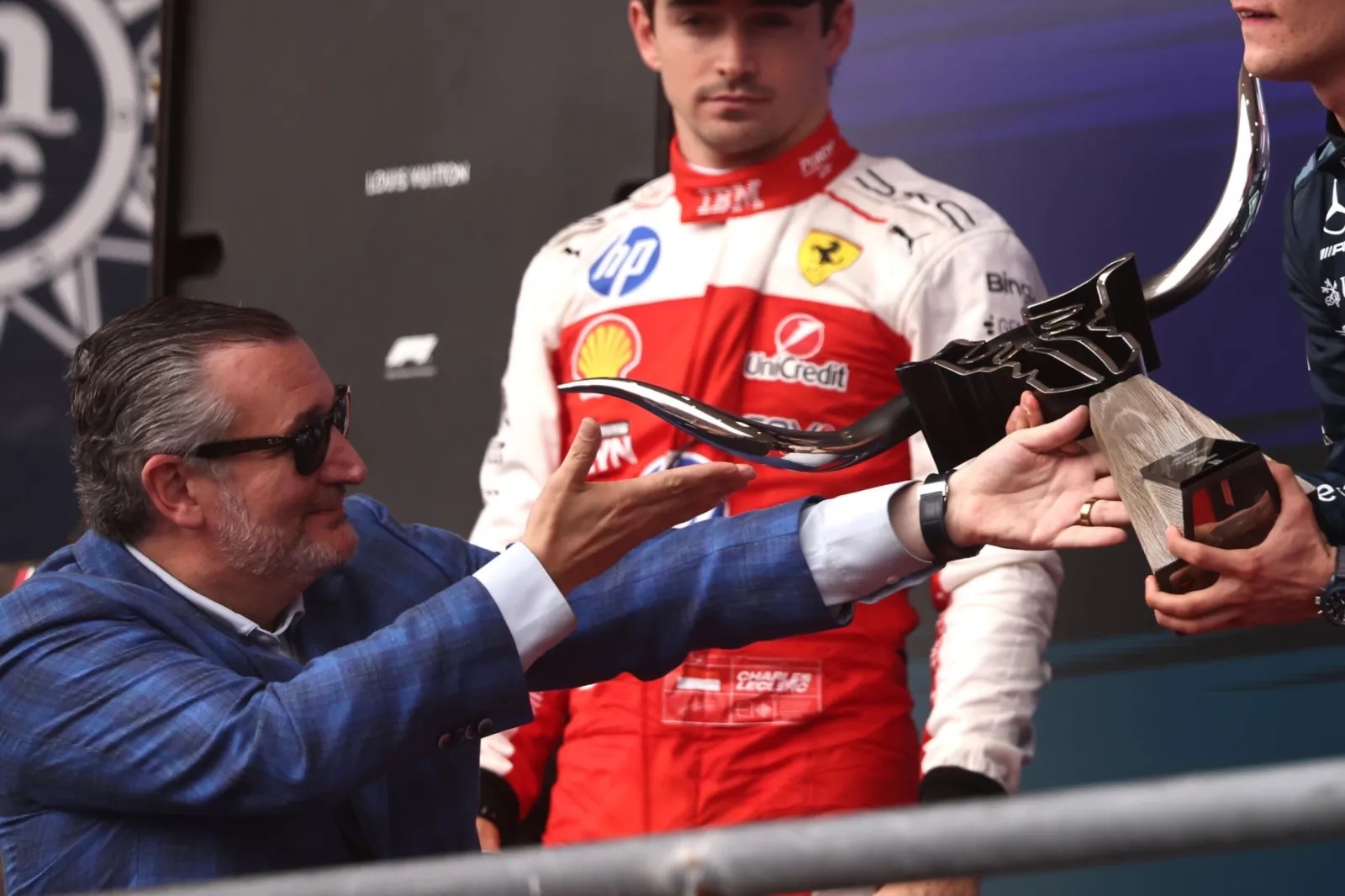 Race winner Andrea Kimi Antonelli of Italy and Mercedes is presented with his trophy by U.S. Senator Ted Cruz on the podiumafter Formula 1's U.S. Grand Prix at Circuit of The Americas in Austin, Texas, on October 25.