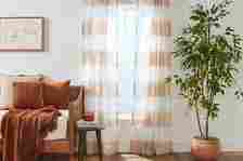 Floor-length curtains in a living room interior