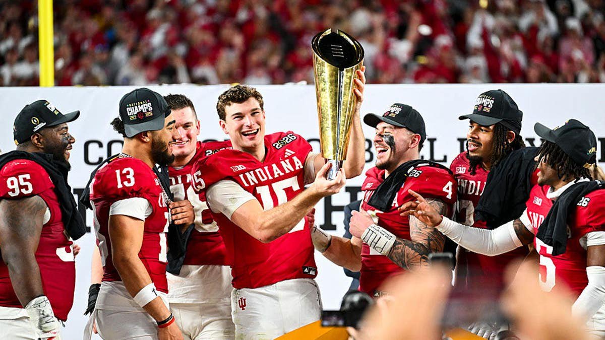 The Indiana Hoosiers lift the trophy after the College Football Playoff National Championship between the Indiana Hoosiers and the Miami Hurricanes. (Photo by CFP/Getty Images)