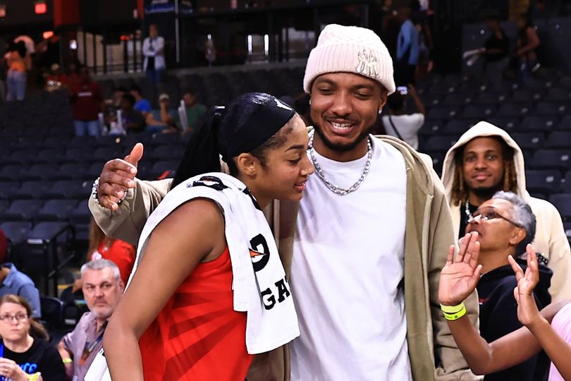 Wendell Carter Jr. and Angel Reese hug after a Dream game