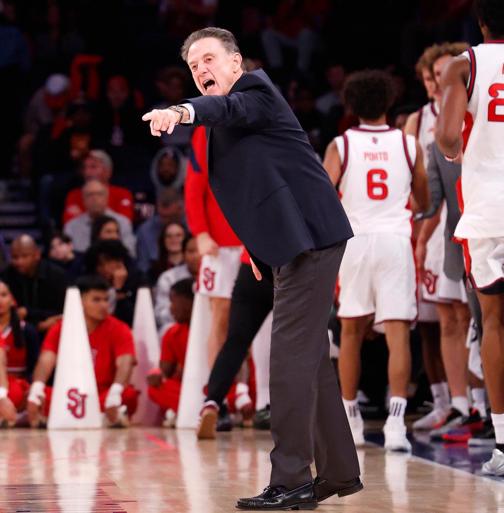 St. John's head coach Rick Pitino passionately argues from the sideline during a game against the Texas Longhorns.