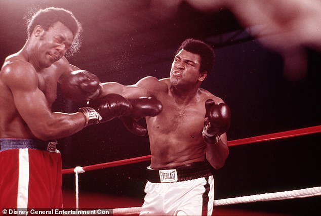 Legendary: Foreman is seen taking on Muhammad Ali in The Rumble In The Jungle in 1974