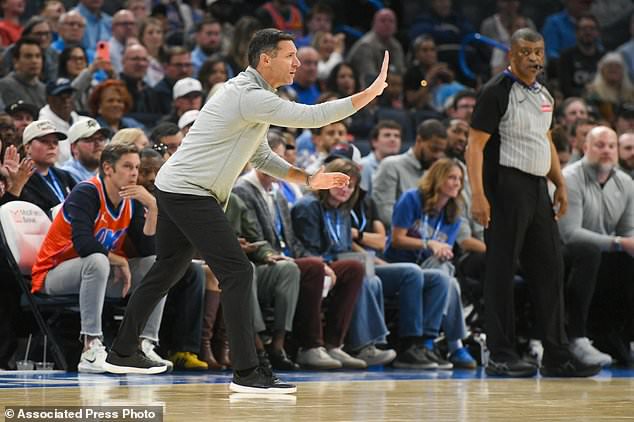 Oklahoma City Thunder head coach Mark Daigneault, front left, gives instruction during the first half of an NBA basketball game against the Phoenix Suns, Monday, Oct. 26, 2026, in Oklahoma City. (AP Photo/Kyle Phillips)