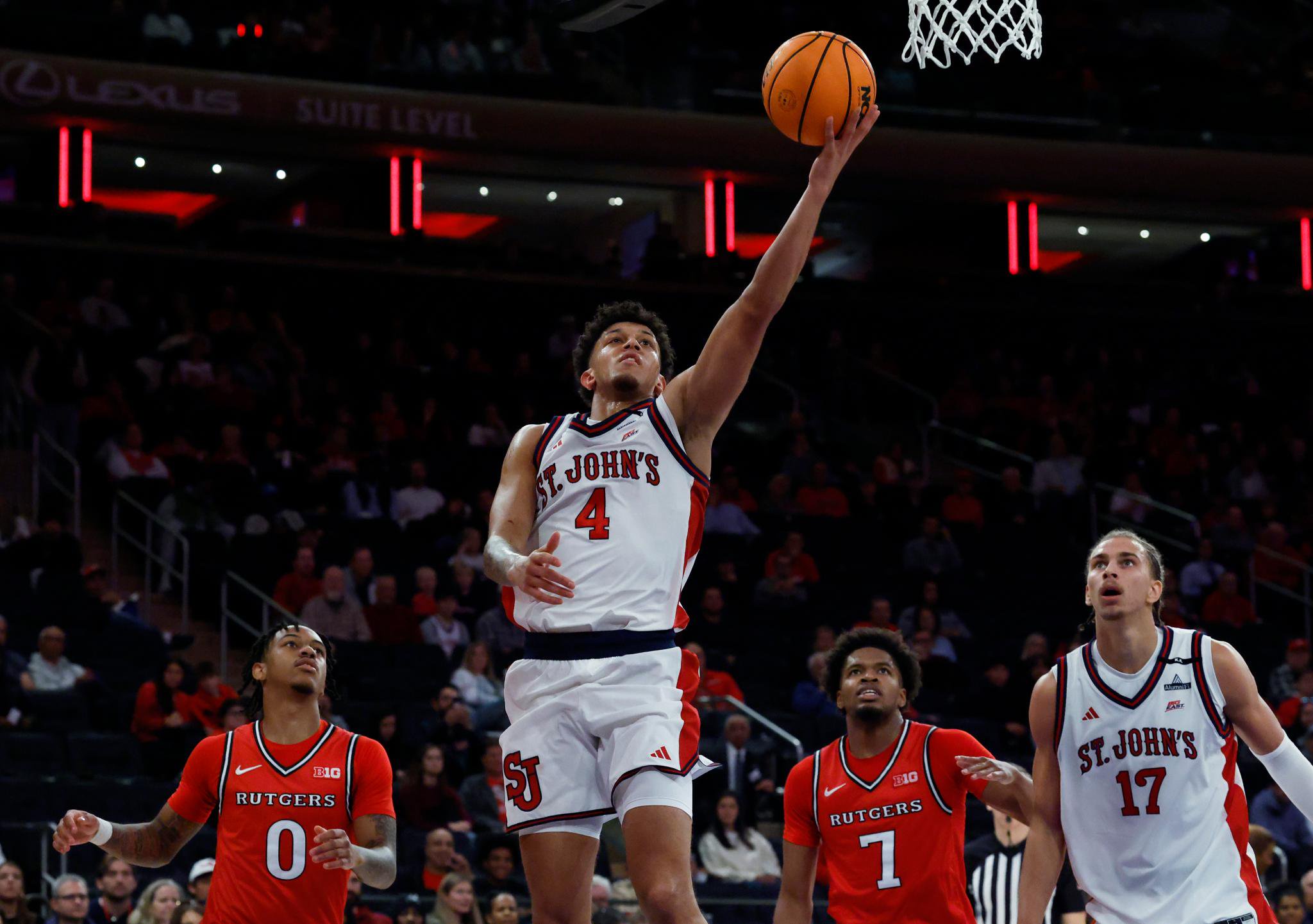St. John's Red Storm Quinn Ellis puts up a shot past the Rutgers Scarlet Knights defense during the first half at Madison Square Garden in New York, USA, Sunday, October 18, 2026. St. John's Red Storm Quinn Ellis puts up a shot past the Rutgers Scarlet Knights defense during the first half at Madison Square Garden in New York, USA, Sunday, October 18, 2026.