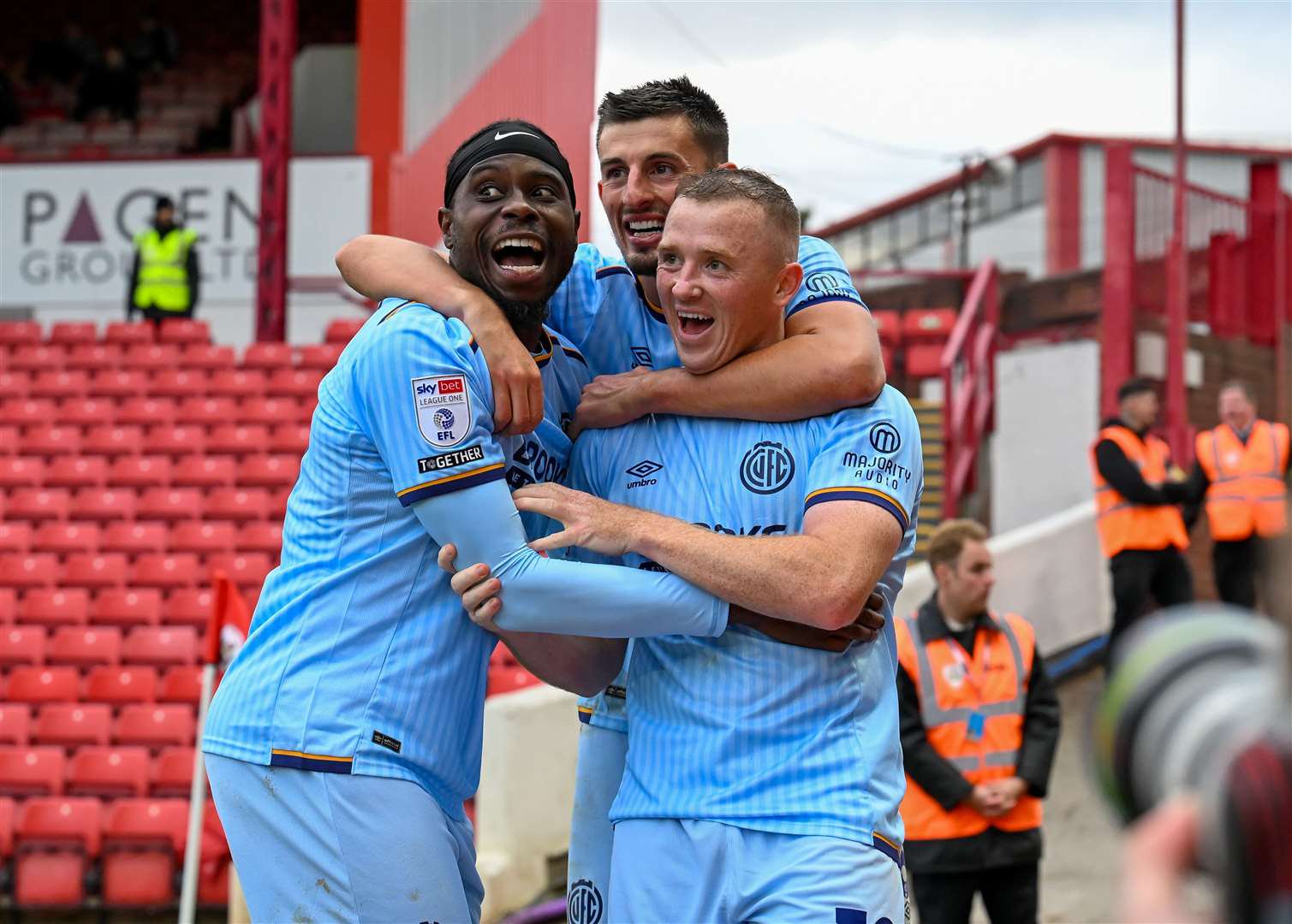 Shayne Lavery is mobbed by team-mates after scoring the winner. Picture: Simon Lankester