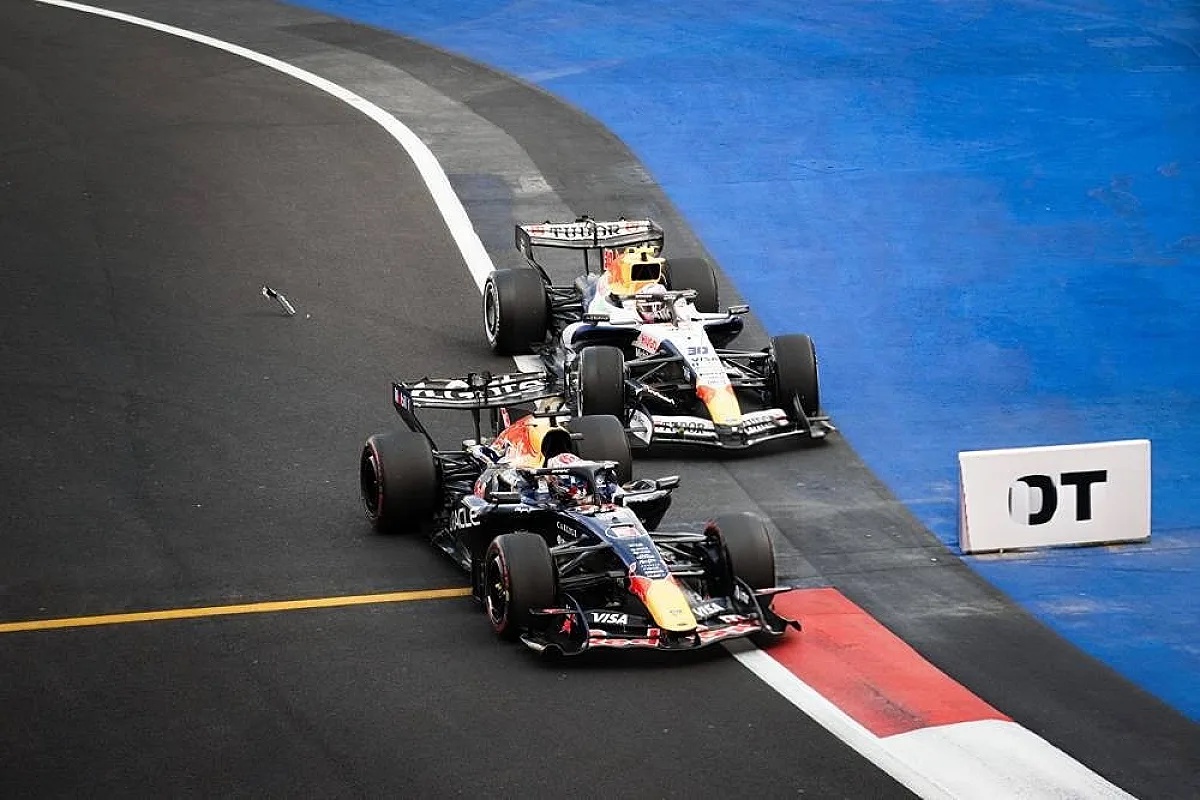 Red Bull F1 cars of Max Verstappen and Liam Lawson clash on a track corner, with debris visible at Mexico City GP