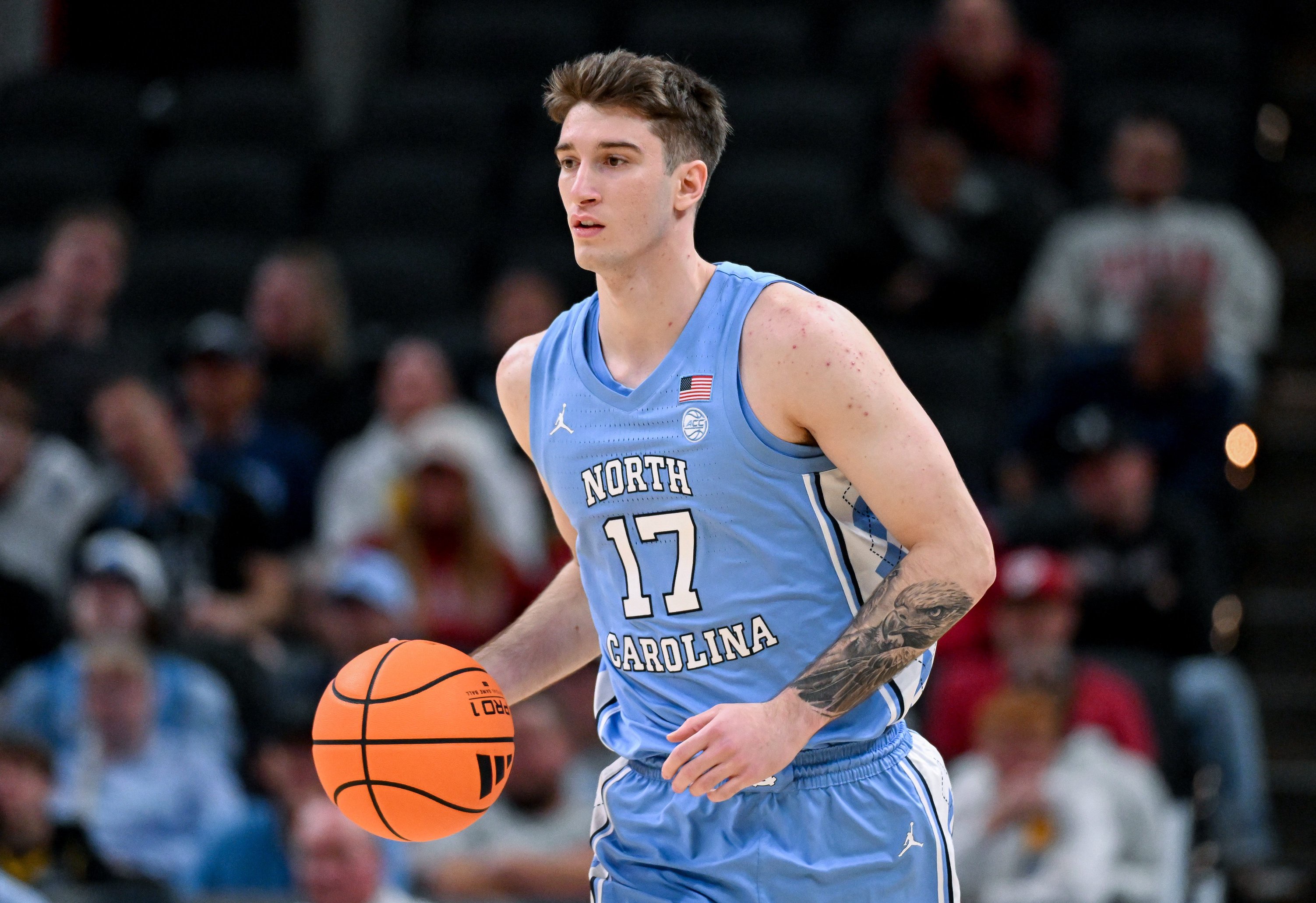 Oct 18, 2026; Indianapolis, IN, USA; North Carolina Tar Heels guard Neo Avdalas (17) dribbles the ball against the Indiana Hoosiers during the first half at Gainbridge Fieldhouse. Mandatory Credit: Robert Goddin-Imagn Images