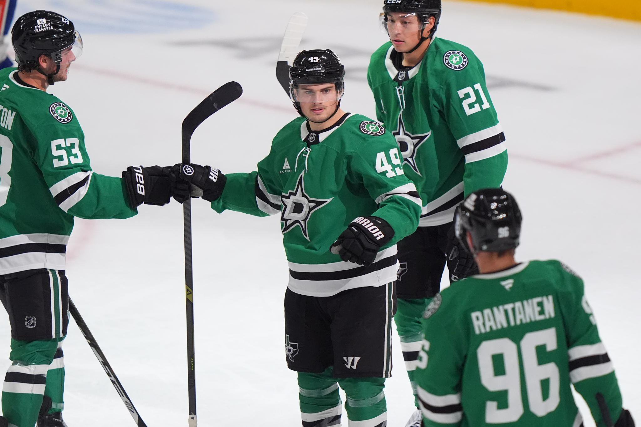 Dallas Stars center Justin Hryckowian celebrates a goal with teammates Wyatt Johnston, Jason Robertson and Mikko Rantanen.