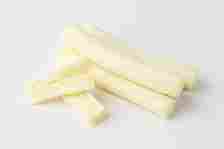 Image of a pile of string cheese sticks on a plain background