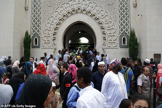 Muslim worshippers leave at the end of prayers at the Grand Mosque of Paris