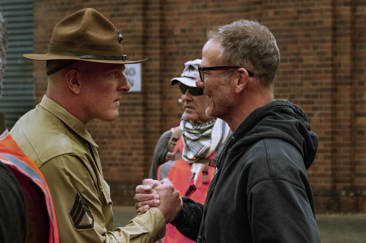 Pat McAfee and director Peter Berg on the set of 