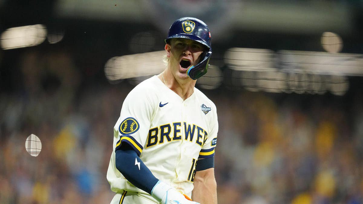 Cooper Pratt celebrates after hitting an RBI single during Game 2 of the World Series.