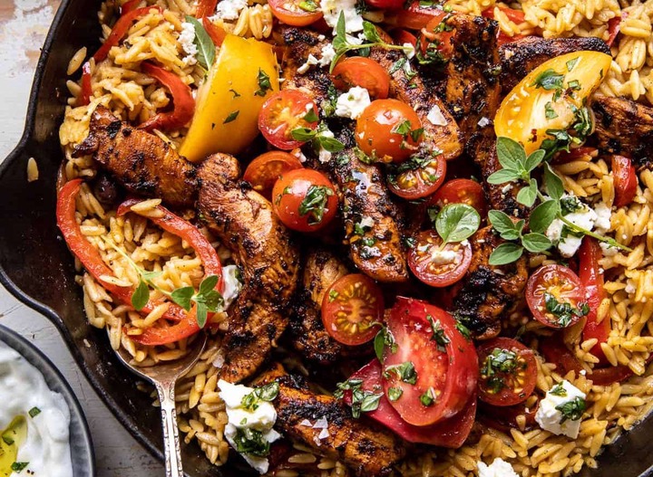 Slide 3 of 14: Herby chicken! Tangy tomatoes! Creamy orzo! What else could you ask for? This skillet dinner has everything you need for a weeknight meal all in one pan.Get the recipe at Half-Baked Harvest.