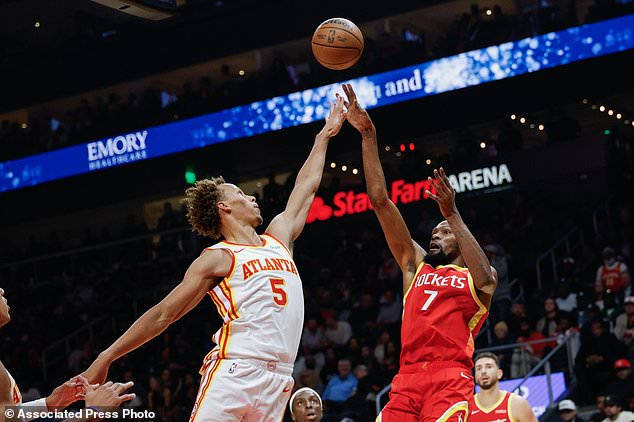 Houston Rockets forward Kevin Durant (7) shoots against Atlanta Hawks guard Dyson Daniels (5) during the first half of an NBA basketball game, Saturday, Oct. 24, 2026, in Atlanta. (AP Photo/Erik S. Lesser)