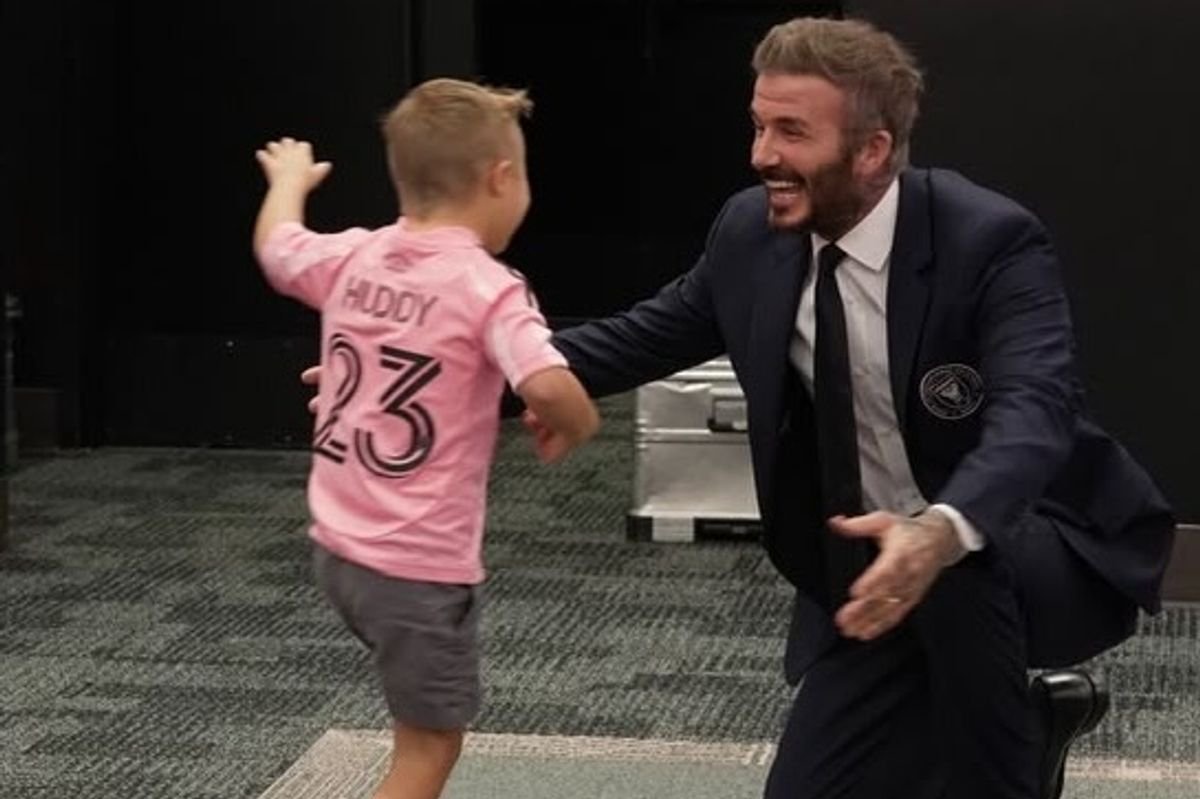 Adorable moment David Beckham meets 5 year old Down syndrome lad Huddy