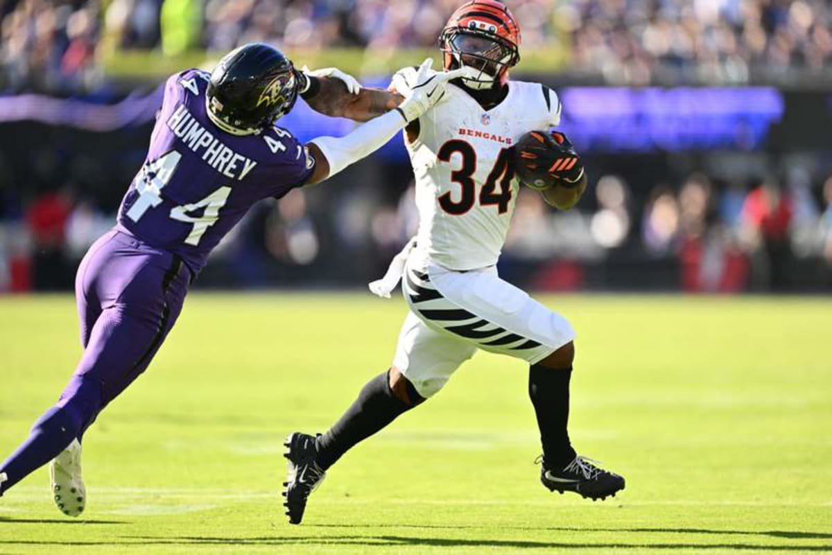 Oct 25, 2026; Baltimore, Maryland, USA; Cincinnati Bengals halfback Samaje Perine (34) holds back Baltimore Ravens cornerback Marlon Humphrey (44) during the second half at M&T Bank Stadium. © Jamie Sabau-Imagn Images