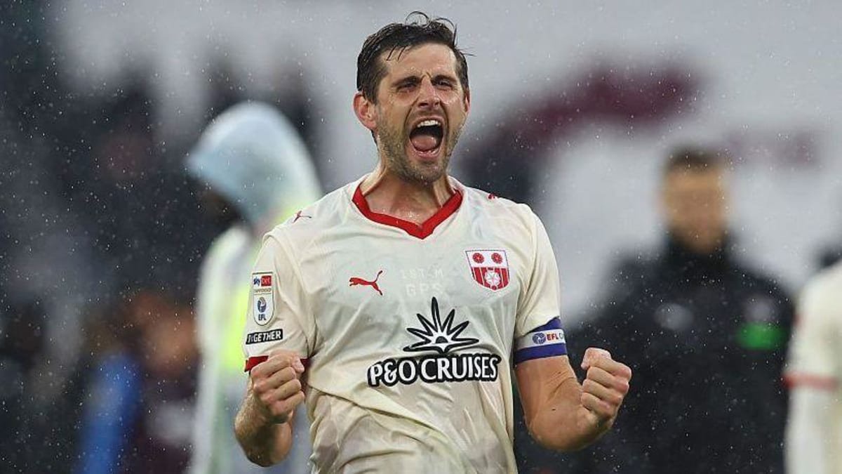 Jack Stephens clenches his fists in celebration and stands with his eyes closed and mouth open as he celebrates after Southampton beat West Ham