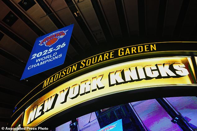 The New York Knicks 2025-26 World Champions banner is raised before an NBA basketball game between the Knicks and the Philadelphia 76ers Tuesday, Oct. 20, 2026, in New York. (AP Photo/Frank Franklin II)