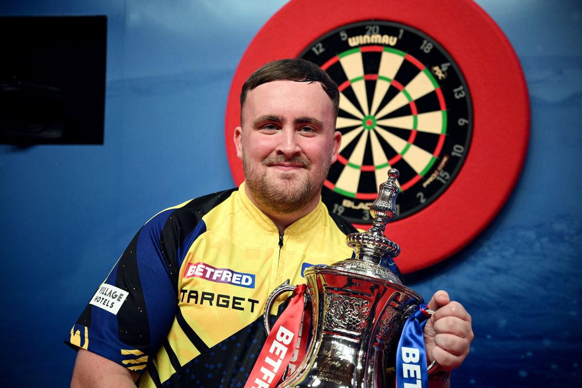  Luke Littler poses for a photo with the 2026 Betfred World Matchplay trophy 