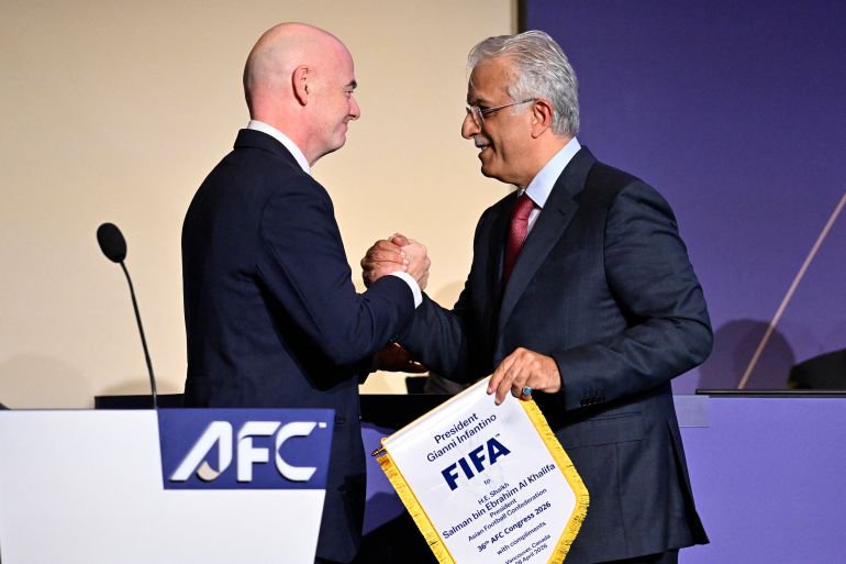 Soccer Football - 36th AFC Annual Congress - Vancouver Convention Centre, Vancouver, Canada - April 28, 2026 FIFA president Gianni Infantino shakes hands with Senior Vice-president of the FIFA Council, Salman bin Ibrahim Al Khalifa during the congress REUTERS/Jennifer Gauthier