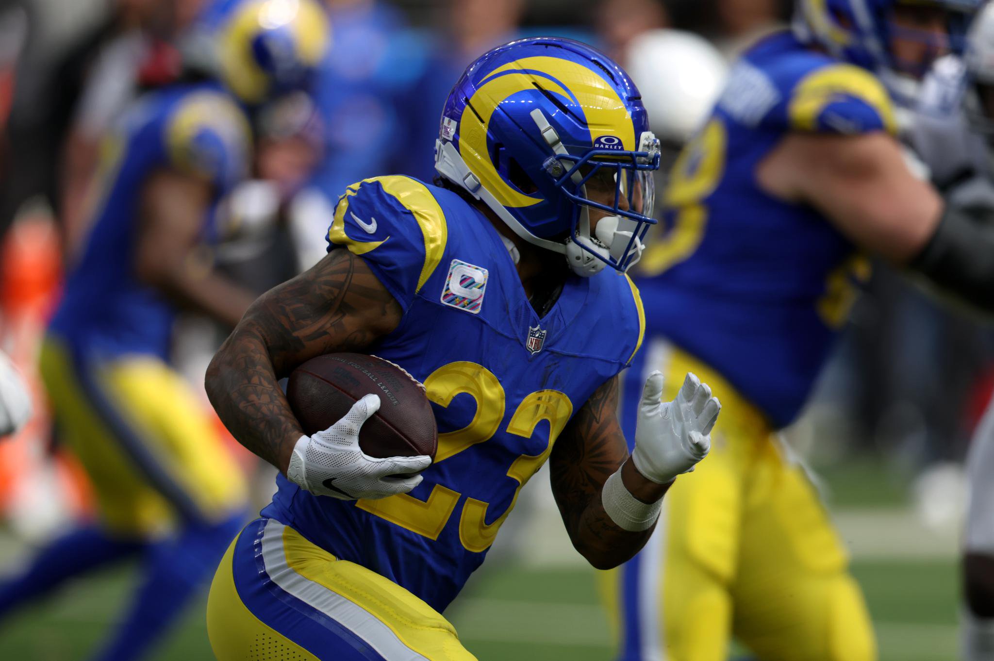 Los Angeles Rams running back carries the ball during the game against the Arizona Cardinals.