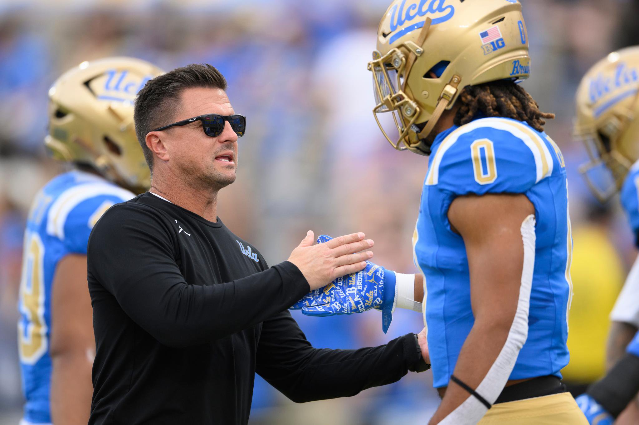 Bob Chesney talks with Donavyn Pellot during a game.
