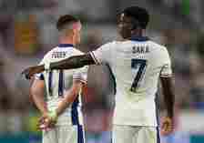 Bukayo Saka and Phil Foden of England during the UEFA EURO 2024 group stage match between England and Slovenia at Cologne Stadium on June 25, 2024 ...