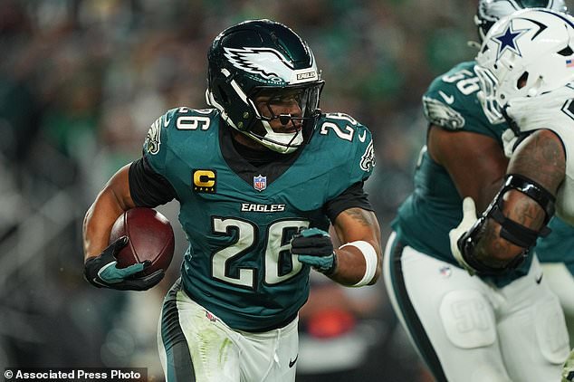 Philadelphia Eagles running back Saquon Barkley runs the ball during the second half of an NFL football game against the Dallas Cowboys in Philadelphia, Monday, Oct. 26, 2026. (AP Photo/Matt Rourke)