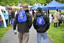 Two veterans walk through the rows of vendor tents during the 3rd annual Veterans Celebration of Carroll County at the Farm Museum in Westminster.(Thomas Walker/Freelance)