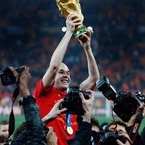 Andrés Iniesta - , SOUTH AFRICA - JULY 11: Andres Iniesta of Spain  celebrates the victory with the trophy  during the  World Cup match between Holland  v Spain  on July 11, 2010 (Photo by Dale Macmillan/Soccrates/Getty Images)