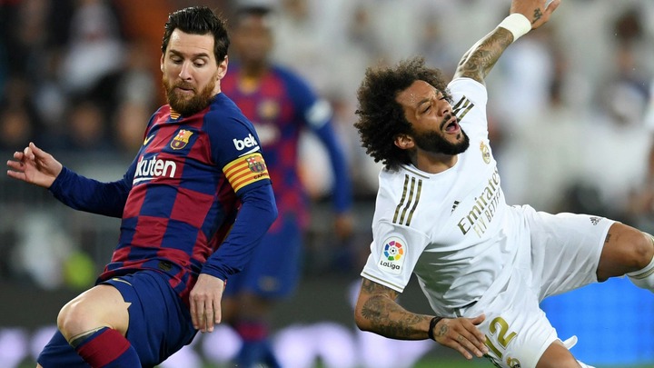 Lionel Messi and Marcelo battling in El Clasico