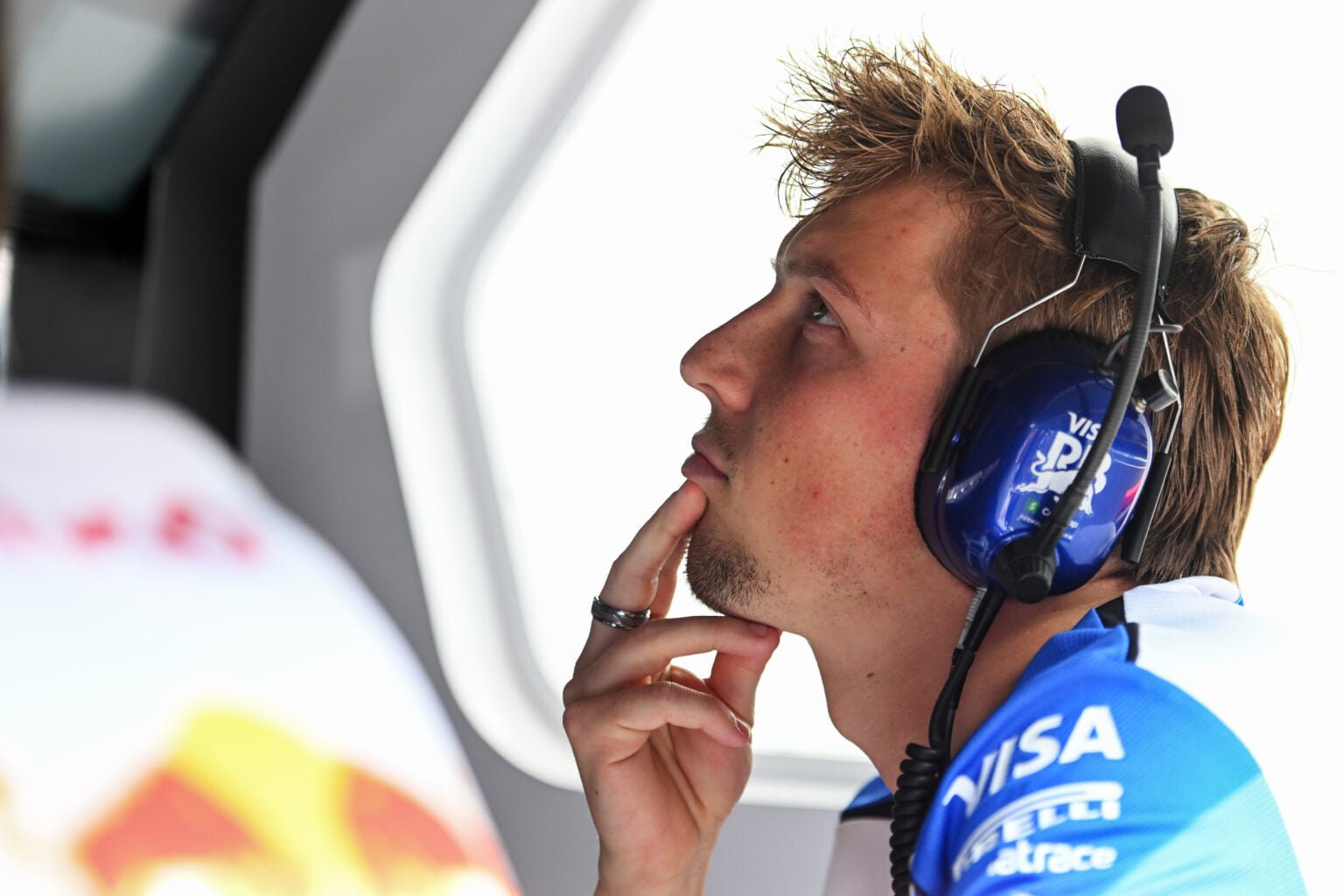 Racing Bulls driver Liam Lawson looks on from the pit wall during FP1 at the 2026 F1 Mexico City Grand Prix while Nikola Tsolov drives his car