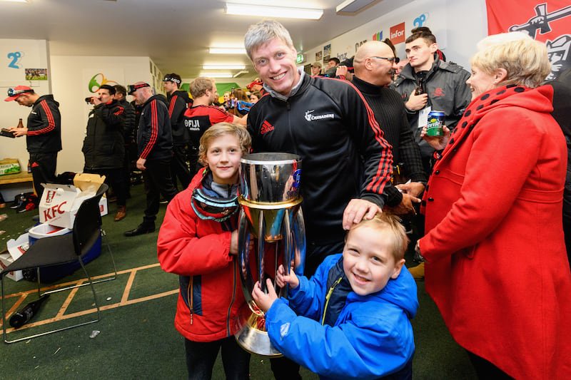 Ronan O'Gara of the Crusaders and his children pose with the Super Rugby trophy on July 06, 2019, in Christchurch, New Zealand. Photograph: Kai Schwoerer/Getty Images