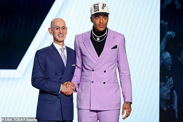 Sochan shakes hands with NBA commissioner Adam Silver after being selected as ninth pick