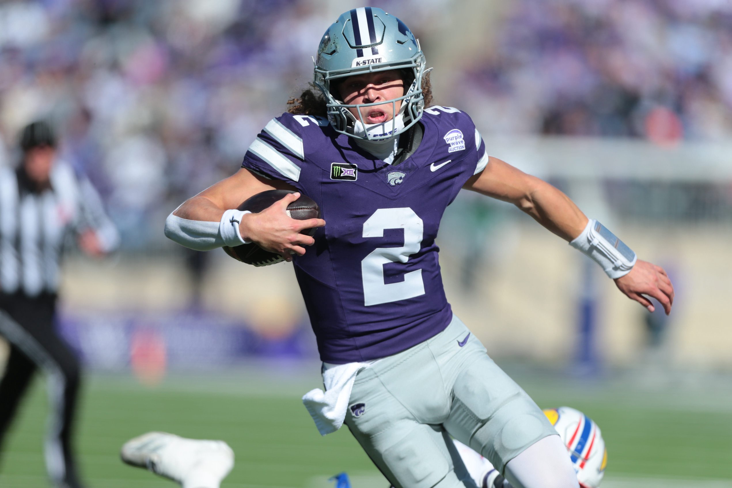 Kansas State Wildcats quarterback Avery Johnson (2) runs the ball against Kansas Jayhawks during the Sunflower Showdown game at Bill Snyder Family Stadium in Manhattan, Kansas on Oct. 17, 2026.