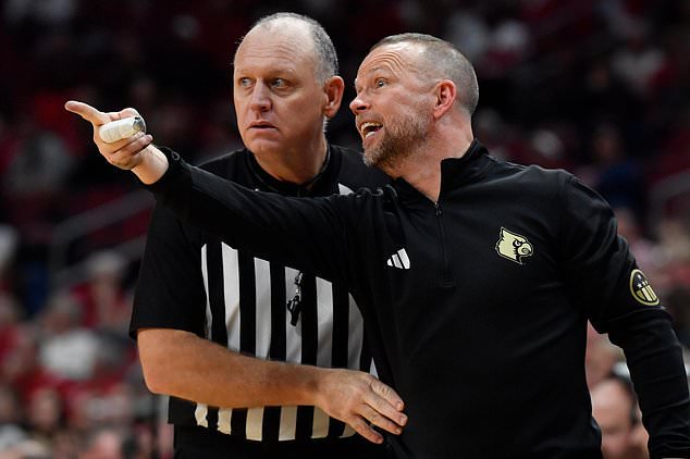FILE - Louisville head coach Pat Kelsey, right, argues a call with referee Tim Clougherty during the second half of an NCAA college basketball game against Ohio in Louisville, Ky., Nov. 15, 2025. (AP Photo/Timothy D. Easley, File)
