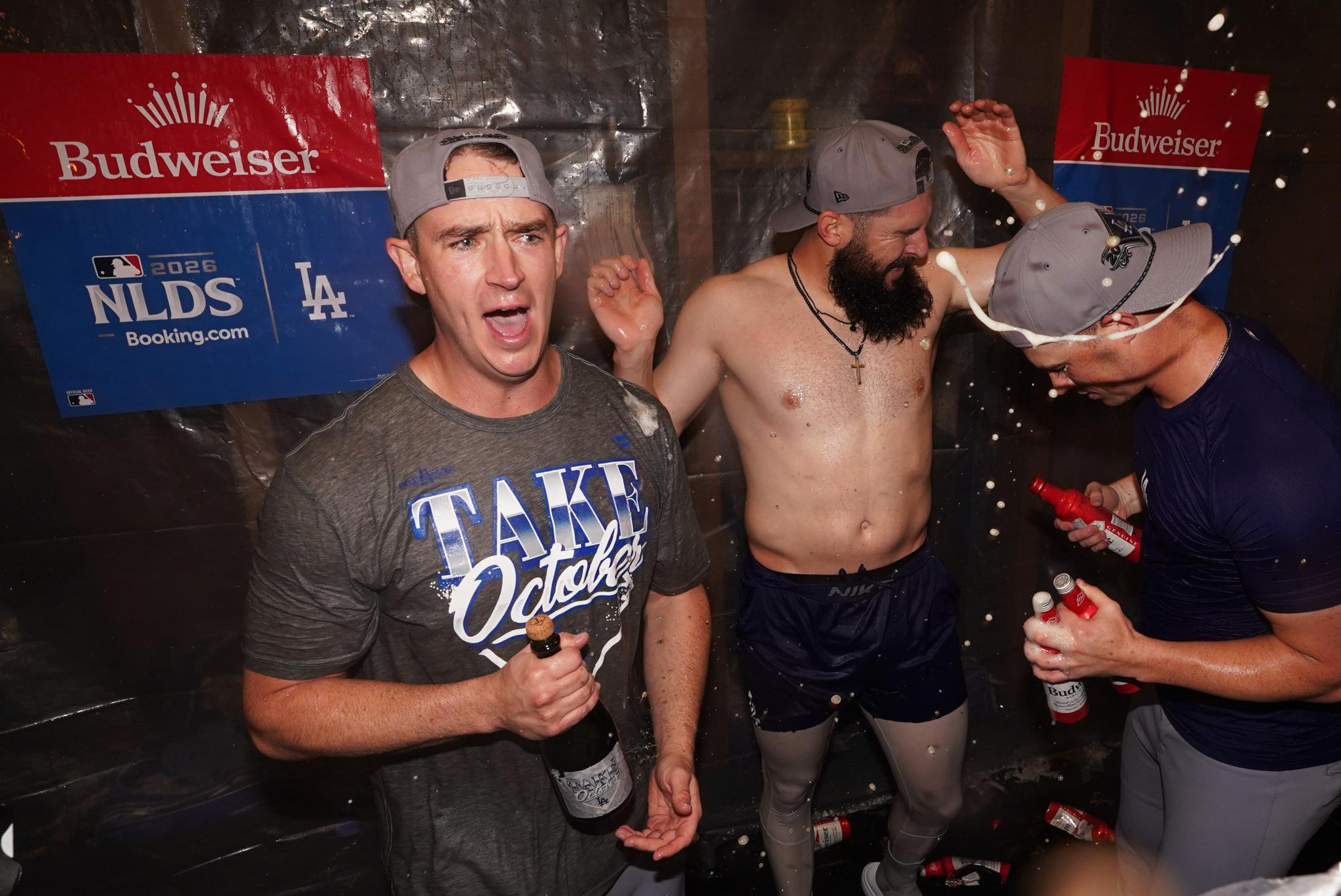 Los Angeles Dodgers pitchers Evan Phillips and Alex Vesia celebrate in the locker room after winning game four of the NLDS.
