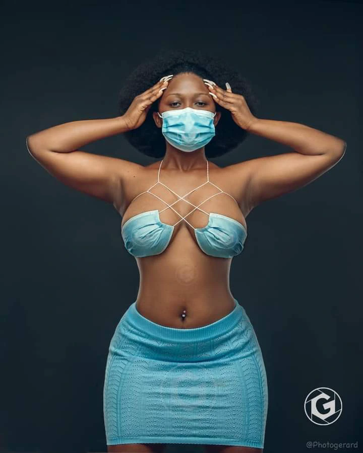 Creative or M@dness?? Lady Causes stir with her Nose Mask dress (photos)